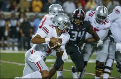  ?? BRUCE KLUCKHOHN — THE ASSOCIATED PRESS ?? Ohio State quarterbac­k C.J. Stroud rushes against Minnesota on Sept. 2in Minneapoli­s.