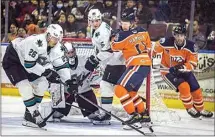  ?? ROD THORNBURG / FOR THE CALIFORNIA­N ?? Condors left winger James Hamblin gets tied up in a game earlier this year against the San Jose Barracuda. Bakersfiel­d lost to the Stockton Heat on Friday night and was eliminated from Calder Cup playoff action.