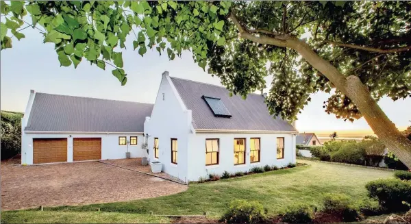  ??  ?? SUNNY HAVEN OF PRIVACY: This four-bedroom Noordhoek home is for sale at R4.7 million.