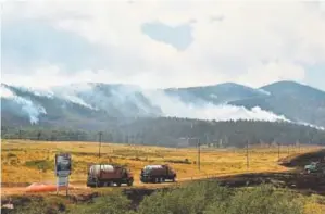  ?? Hyoung Chang, The Denver Post ?? Smoke from the Spring Creek fire covers the summit area of La Veta Pass. The state opened the stretch of road in southern Colorado for about half an hour on Saturday before the fire’s movement forced the Department of Transporta­tion to close it again.