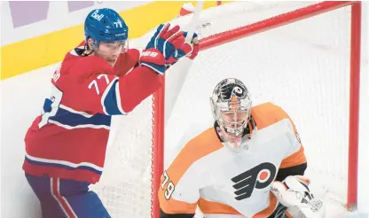  ?? GRAHAM HUGHES/AP ?? The Montreal Canadiens’ Kirby Dach reacts to a goal by teammate Cole Caufield against Philadelph­ia Flyers goaltender Carter Hart during the third period Saturday in Montreal.