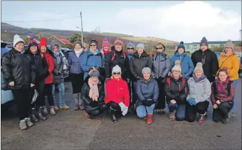  ?? KC_c09mindove­rmiles01 ?? Most of the walkers who joined Sunday’s outing to Glen Lussa power station.