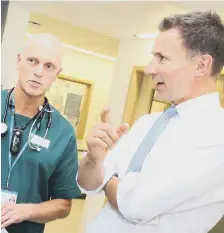  ??  ?? Jeremy Hunt (right) with Sunderland Royal Hospital care consultant Chris Phillips.