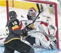  ?? ETHAN MILLER/GETTY IMAGES ?? Reilly Smith of the Golden Knights goes top shelf on Capitals goalie Braden Holtby in the second period of Game 1.