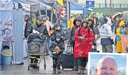  ?? ?? Desperate Refugees at the Polish border fleeing from war-torn Ukraine. Alasdair Macpherson (right) blames red tape and has called for urgency