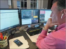  ?? DANIELLE CORPINA — COURTESY JONATHAN CORPINA VIA THE ASSOCIATED PRESS ?? Jonathan Corpina, Senior Managing Partner at Meridian Equity Partners Inc., who normally works on the New York Stock Exchange trading floor, Wednesday works in his home office in Armonk, NY., as traders avoided the exchange floor over coronaviru­s concerns.