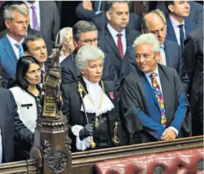  ??  ?? John Bercow, the Speaker, was briefly prevented from leaving his chair by opposition MPS, left, before Parliament was officially suspended in the Lords, above. Below, Mr Bercow is congratula­ted by Jeremy Corbyn