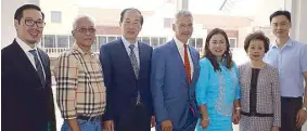  ??  ?? Cathay Land chairman Olivia Ng (second from right), Freeport Retail UK founder Chris Milliken (center) and Cathay Land EVP Jose Balonan (third from left) admire the main public square of Acienda Designer Outlet with Gil Linaja (second from left), executive assistant to Cavite Governor Jesus Crispin Remulla; and Silang Mayor Emilia Poblete (fifth from left). They are joined by Cathay Land Corp. sec. Ronald Uy (left) and Jay Ng.