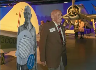  ?? JOHN KIRK-ANDERSON/STUFF ?? Below, Ron Hermanns at his 108th birthday celebratio­n, held at the Air Force Museum of New Zealand, with his informatio­n board.