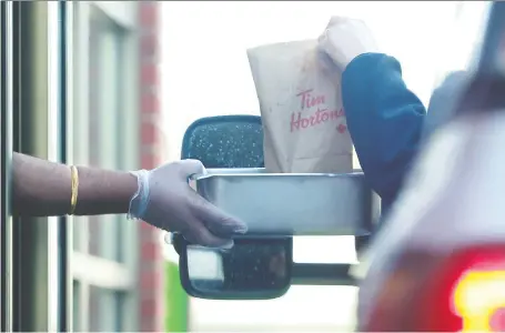  ?? JULIE OLIVER ?? Tim Hortons says it has scaled back its data collection as four privacy commission­ers conduct a rare investigat­ion on its ordering app.