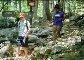  ?? (Democrat-Gazette file photo/Stephen Swofford) ?? Hiking along the West Summit Trailhead is a popular activity in Pinnacle Mountain State Park in summer and also for First Day Hikes, 10 a.m.-noon on New Year’s Day.