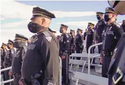  ?? NEW MEXICO STATE POLICE ?? New Mexico State Police officers from around the state gather on the bleachers at the funeral of fallen officer Darian Jarrott on Friday afternoon in Lordsburg.