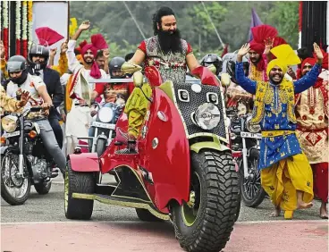  ??  ?? Huge support: The quasirelig­ious sect leader, who calls himself Saint Dr Gurmeet Ram Rahim Singh Ji Insaan, arriving for a press conference ahead of the release of his new film MSG, The Warrior Lion Heart in New Delhi in this file picture. — AP