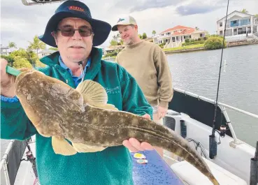  ?? ?? John caught and released this 69cm flathead on a Gold Coast charter with Clint from Gold Coast River Charters