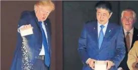  ?? REUTERS ?? Amid the pageantry, Trump and Abe paused to feed Asian carp fish in a pond. Trump concluded the activity by theatrical­ly holding out his box of feed and dumping it into the water packed with fish.