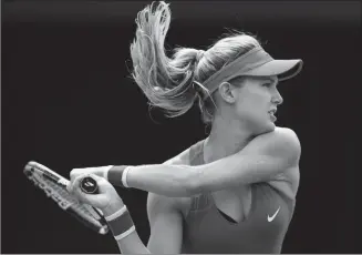  ?? The Canadian Press ?? Canada’s Eugenie Bouchard returns a shot to Donna Vekic of Croatia during their first-round match at the Rogers Cup women's tennis tournament in Toronto on Tuesday.