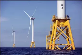  ?? MICHAEL DWYER — THE ASSOCIATED PRESS FILE ?? Three of Deepwater Wind’s turbines in the water off Block Island, R.I. A huge wind farm off the Massachuse­tts coast is edging closer to federal approval, setting up what the Biden administra­tion hopes will be a model for a sharp increase in offshore wind energy developmen­t along the East Coast.