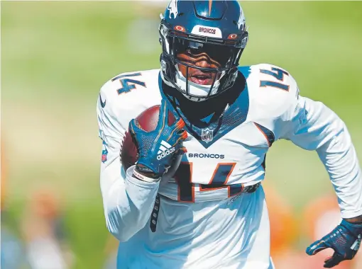  ?? David Zalubowski, The Associated Press ?? Broncos wide receiver Courtland Sutton runs a drill Monday before his tussle with teammate Emmanuel Sanders.