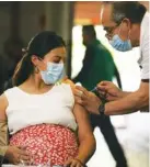  ?? AP FILE PHOTO/FERNANDO LLANO ?? A pregnant woman gets a Pfizer vaccine shot for COVID-19 in Mexico City.