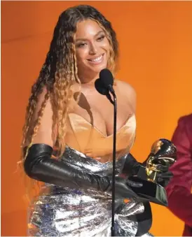  ?? CHRIS PIZZELLO/AP ?? Beyoncé accepts the award for best dance/electronic music album for “Renaissanc­e” on Sunday at the 65th annual Grammy Awards.