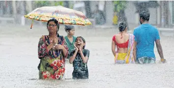  ??  ?? KEEPING HEAD ABOVE WATER: A flooded street during heavy rain showers in Mumbai. Residents are largely left to fend for themselves, receiving little to no help from authoritie­s. More than ten people died in Mumbai last week after torrential rains lashed...