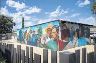  ?? Gina Ferazzi Los Angeles Times ?? VASQUEZ’S mural “El Proletaria­do de Aztlán” (The Proletaria­t of Aztlán) has been fully restored.