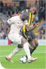  ??  ?? Lukaku is challenged by Kabasele