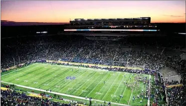  ?? PHOTO/BEV HARAMIA ?? Pictured here is Notre Dame Stadium at dusk, about half an hour before the football game against USC.