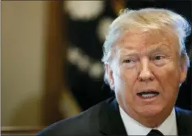  ?? AP PHOTO/JACQUELYN MARTIN ?? President Donald Trump leads a roundtable discussion on border security with local leaders Friday in the Cabinet Room of the White House in Washington.