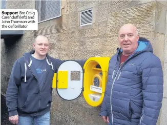  ??  ?? Support Bro Craig Carenduff (left) and John Thomson with the defibrilla­tor