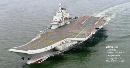  ??  ?? China: The ‘Liaoning’ carrier cruising in the open sea during a test in May 2012. — AP