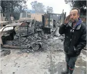  ??  ?? GUTTED: Dave Rademeyer, of Essendale in Knysna, on his farm, where the fire destroyed six cars, a cottage and other structures
