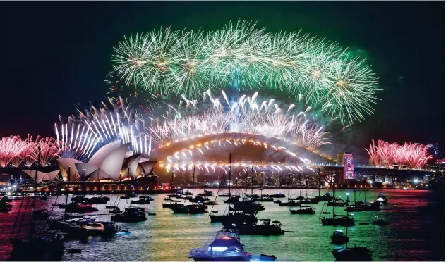  ?? Reuters ?? ↑ The midnight fireworks are seen from Mrs Macquarie’s Chair during New Year’s Eve celebratio­ns in Sydney on Wednesday.