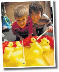  ??  ?? ●●Joseph Pattison and Domenico Iannidinar­di (both 11) trying out the catch a duck stall at St Gabriel’s summer fair