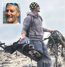  ??  ?? Andrew Frost picking up rubbish from a Cornwall beach