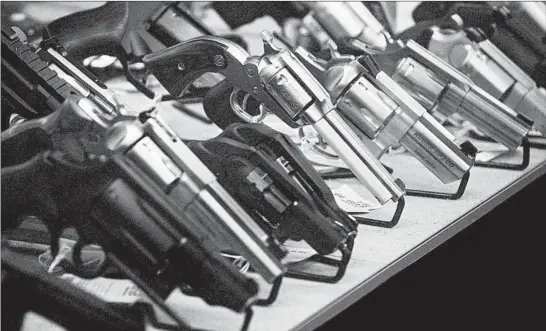  ?? RUTH FREMSON/THE NEW YORK TIMES PHOTOS ?? According to national health statistics, 24,432 Americans used guns to kill themselves in 2018, an increase of almost 26% from figures in 2010. Above, handguns inWashingt­on state.