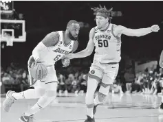  ?? GARY A. VASQUEZ USA Today Network ?? Denver’s Aaron Gordon, right, guarding LeBron James in the Western Conference finals, expects to guard Miami’s Jimmy Butler in the NBA Finals.