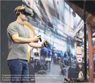  ?? — AFP ?? Facebook co-founder and chief executive, Mark Zuckerberg, speaks at an Oculus developers conference while wearing a virtual reality headset in San Jose, California.
