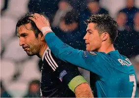  ?? AP ?? Gianluigi Buffon, 40 anni, consolato da Cristiano Ronaldo, 33, dopo la partita