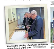  ?? PHOTOS SUPPLIED ?? pictures and plans Viewing the display of for the future of the trust.
Trustee Keith Levy, right, receiving the award from Lord Lieutenant Andrew Coombe.