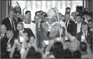  ?? AP/WASON WANICHAKOR­N ?? Pope Francis leaves Bangkok’s Cathedral of the Assumption on Friday after a Mass in which he urged young people “to maintain your joy and to look to the future with confidence.”