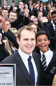  ??  ?? Crackdown: Head Nick Short, pictured with pupils and left, a sign issued with an error