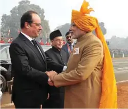 ??  ?? Strengthen­ing ties: (left) Prime Minister Narendra Modi with the President of France François Hollande in Paris on April 10, 2015; (right) Prime Minister Modi with President Hollande, who was the chief guest at the Republic Day in New Delhi, on January...