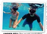  ??  ?? under sea: The couple snorkellin­g