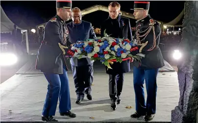  ?? AP ?? French President Emmanuel Macron and Mali’s President Ibrahim Boubacar Keita lay a wreath as they arrive to attend a military ceremony in Reims as part of a World War I commemorat­ion tour.