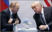  ?? EVAN VUCCI — THE ASSOCIATED PRESS FILE ?? In this file photo U.S. President Donald Trump meets with Russian President Vladimir Putin at the G-20 Summit in Hamburg.