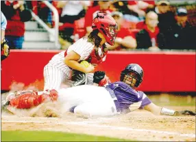  ?? FILE PHOTO ARKANSAS DEMOCRAT-GAZETTE ?? Ashdown senior Bethany Mulholland slides under the tag from Farmington catcher Kelsie Stewart in the sixth inning during the 4A state championsh­ip at Bogle Park in Fayettevil­le on Friday, May 20, 2011. Mulholland was initially called out on the play but the call was overruled. The 2011 softball championsh­ip season is one of the top stories of the decade: 2010-2019 at Farmington.