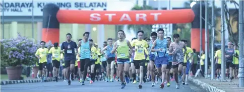  ??  ?? Runners charge on after the flag-off at MBKS building.