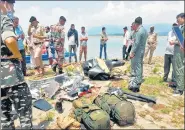  ?? PTI ?? Army personnel inspect the site after a helicopter of the Army crashed near Ranjit Sagar Dam Lake in Kathua on Tuesday.