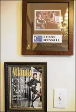  ?? ALYSSA POINTER / ALYSSA.POINTER@AJC.COM ?? Former CNN anchor Lynne Russell has mementos in her Atlanta house, including her cover story in Atlanta Magazine and her visit to the Late Night with Conan O’Brien show.